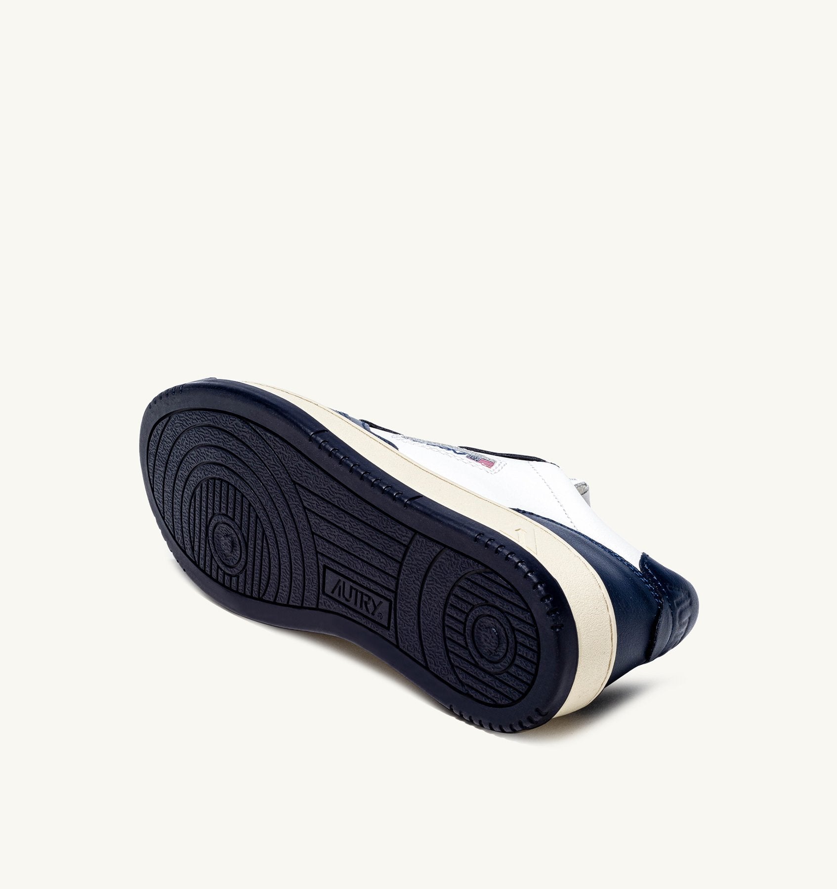 AUTRY - MEDALIST LOW BICOLOR SNEAKERS IN WHITE AND BLUE LEATHER (Men) - ASTOREHERE