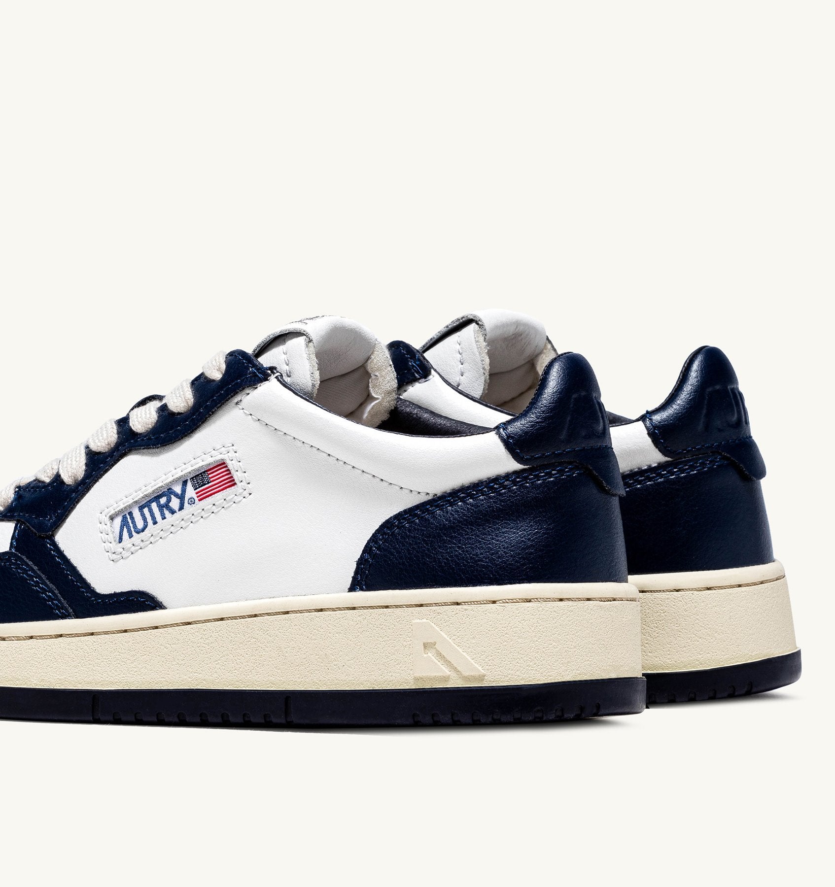 AUTRY - MEDALIST LOW BICOLOR SNEAKERS IN WHITE AND BLUE LEATHER (Men) - ASTOREHERE