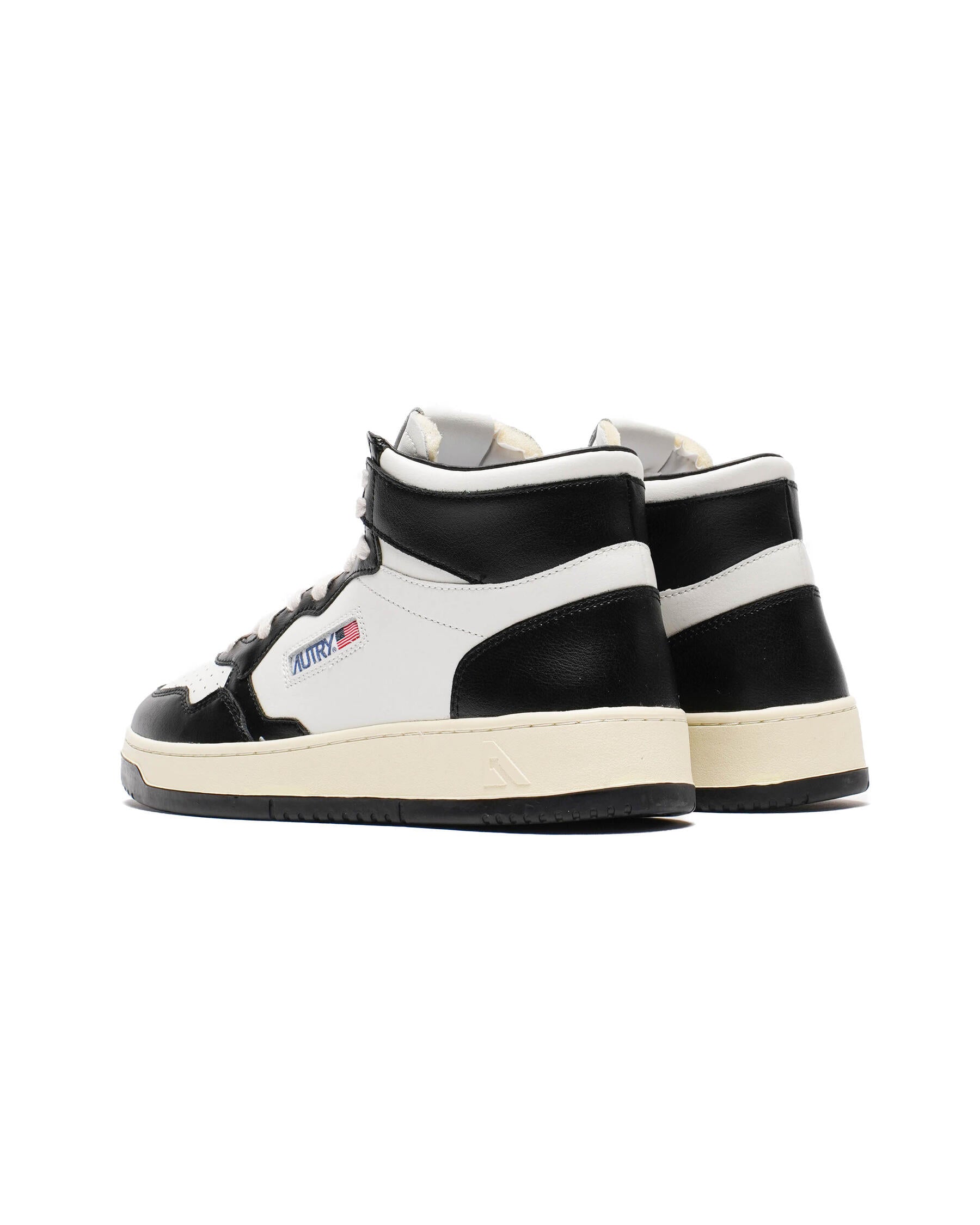 AUTRY - MEDALIST MID BICOLOR SNEAKERS IN WHITE AND BLACK LEATHER (Men) - ASTOREHERE