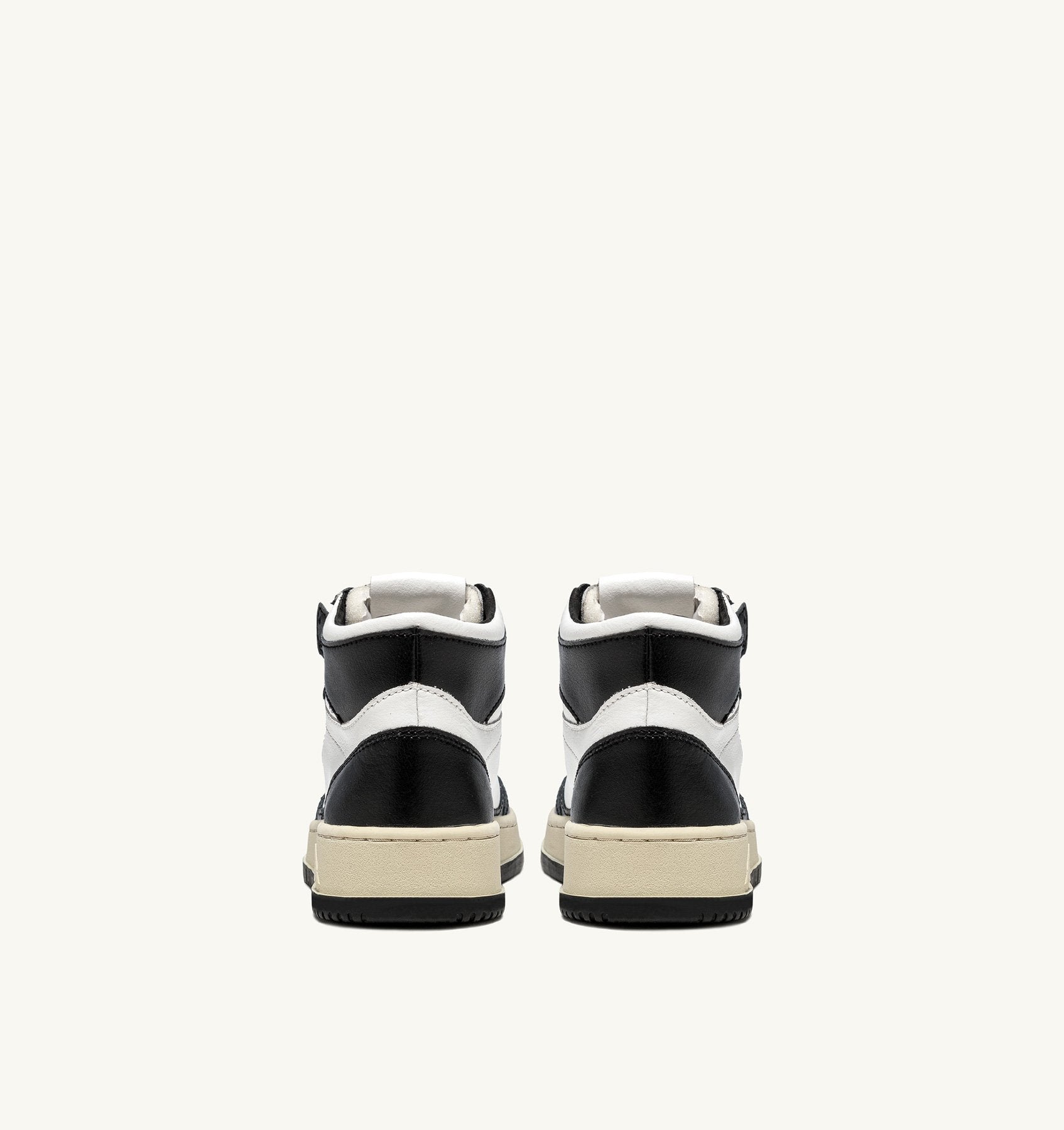 AUTRY - MEDALIST MID BICOLOR SNEAKERS IN WHITE AND BLACK LEATHER (Women) - ASTOREHERE