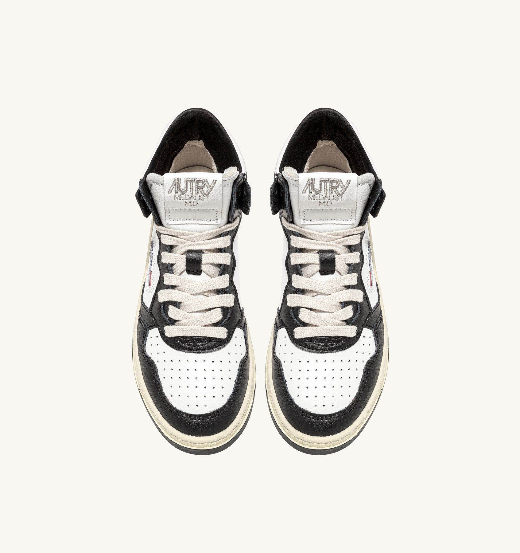 AUTRY - MEDALIST MID BICOLOR SNEAKERS IN WHITE AND BLACK LEATHER (Women) - ASTOREHERE